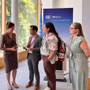 3 ITR delegates giving letter to UNFCCC respresentative