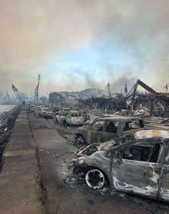 burned out cars and buildings, smoke