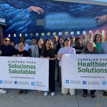group of people with signs "Campaign for Healthier Solutions"